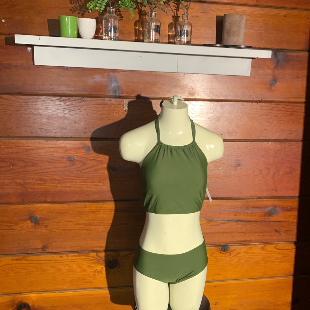 Green 2 piece halter top bikini.